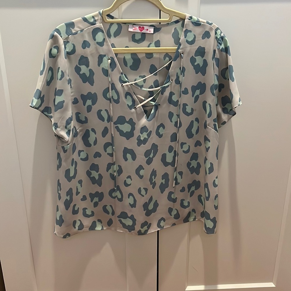 Teal leopard shirt with cross detailing